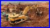Caterpillar-365c-Excavator-Loading-Trucks-And-Operator-View-01-jq
