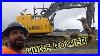 John-Deere-245-G-Excavator-Installing-Man-Hole-Digging-Main-Line-Sewer-Excavator-Johndeere-01-iya