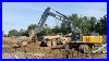 John-Deere-470g-LC-Excavator-Digging-Sanitary-Trench-01-ljs