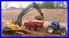 Volvo-Ec210b-Excavator-Loading-John-Deere-And-New-Holland-Tractors-01-yle